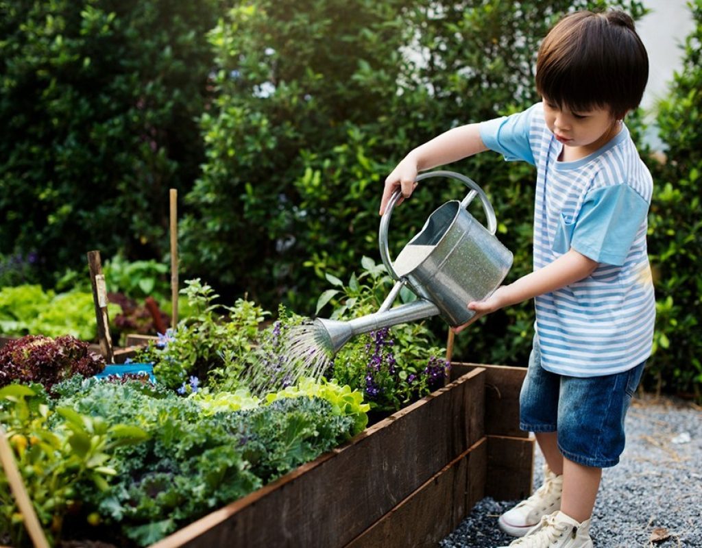 kid-gardening-with-watering-can